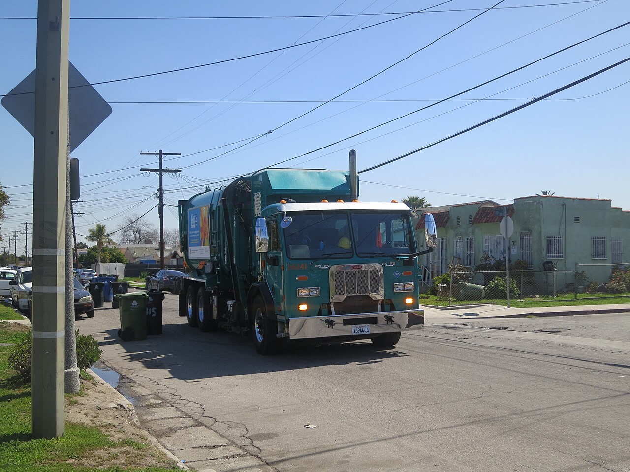 Houston Trash Removal garbage truck on a residential pickup route